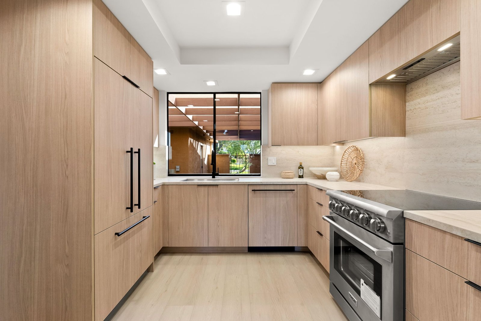 Light colored woodgrain finish on premium custom cabinetry made by Laval for a kitchen in Palm Springs.