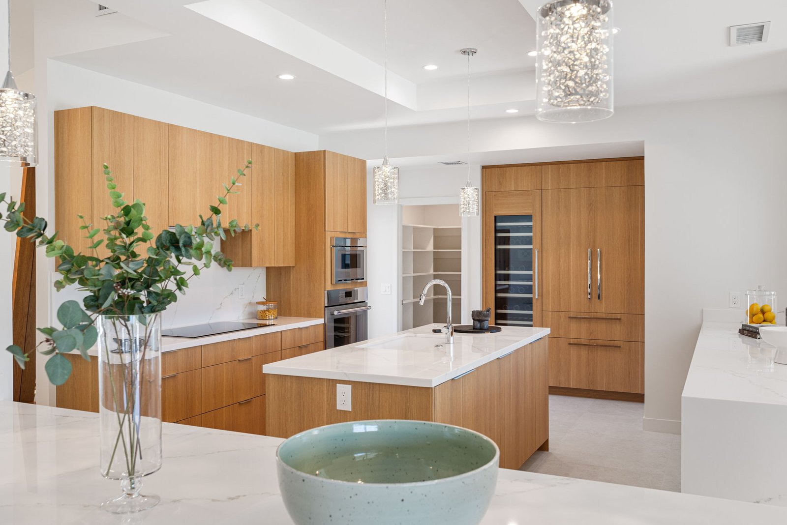Custom cabinets in this modern kitchen with custom measurements for tall, wall, and base cabinets.