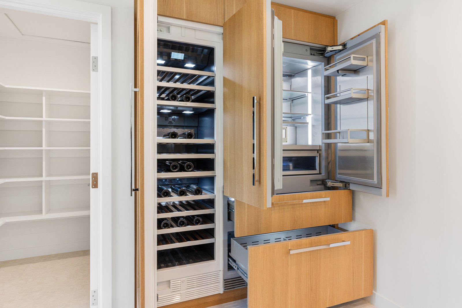 Custom cabinets transform this refridgerator into a work of art with premium panels made to fit the doors and drawer fronts.