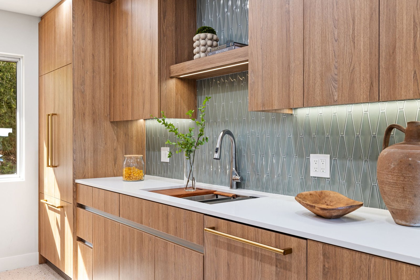 Beautiful and premium custom cabinetry designed to fit this kitchen's modern aesthetic and provide creative storage solutions.