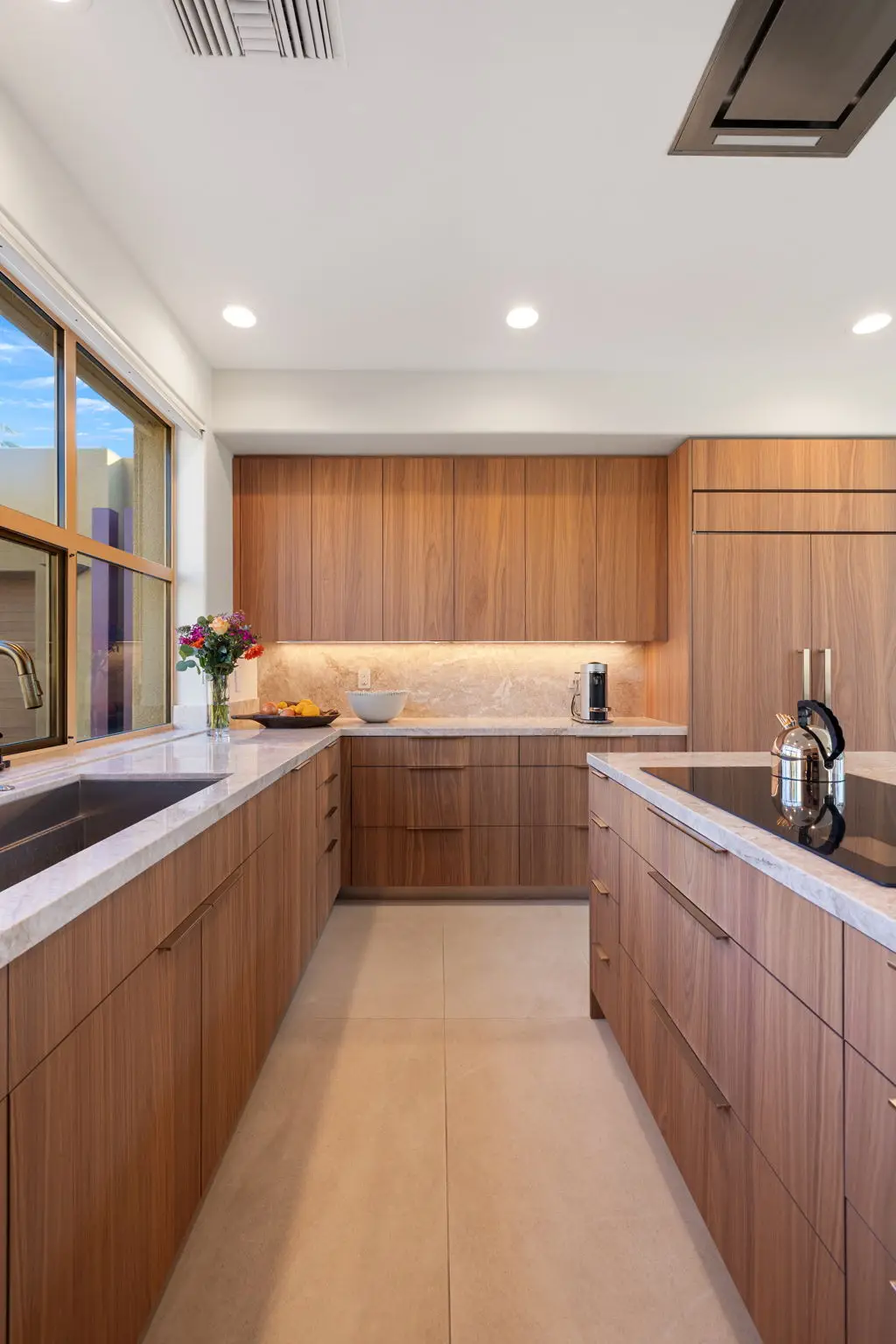 Laval's premium custom cabinetry often becomes the highlight of a home, impressing guests with this beautiful modern kitchen.