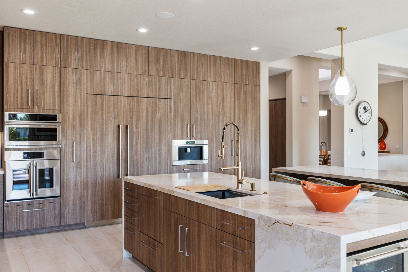 Premium custom cabinetry by Laval allows for a seamless and modern look, fitting this kitchen perfectly.