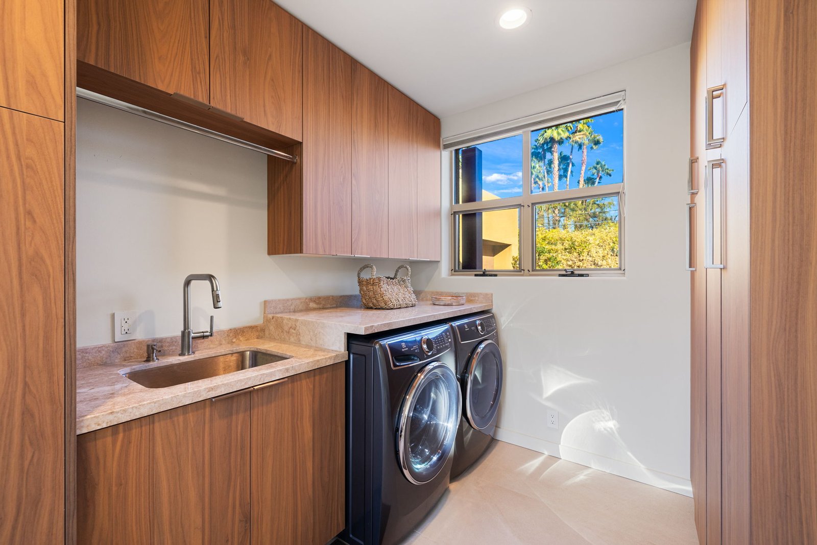 Beautiful custom cabinetry set for this clean laundry room.