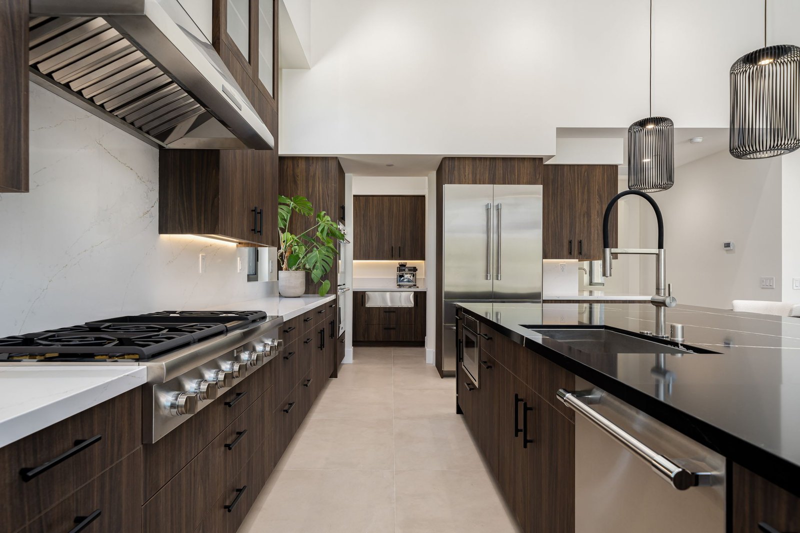 Custom cabinetry fits perfectly around custom cooktop, refrigerator, and dishwasher.