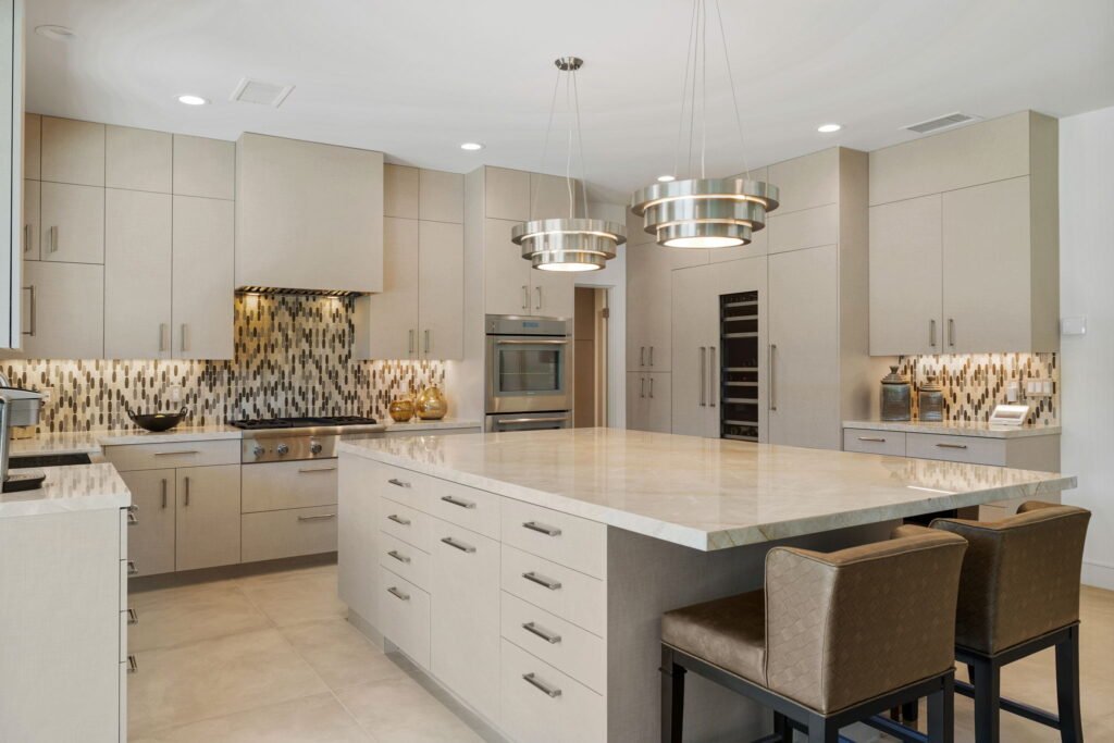 Custom cabinetry tailored to fit this modern kitchen with cabinets integrated into the island.